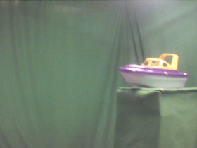 135 Degrees _ Picture 9 _ Purple and Yellow Toy Boat.png